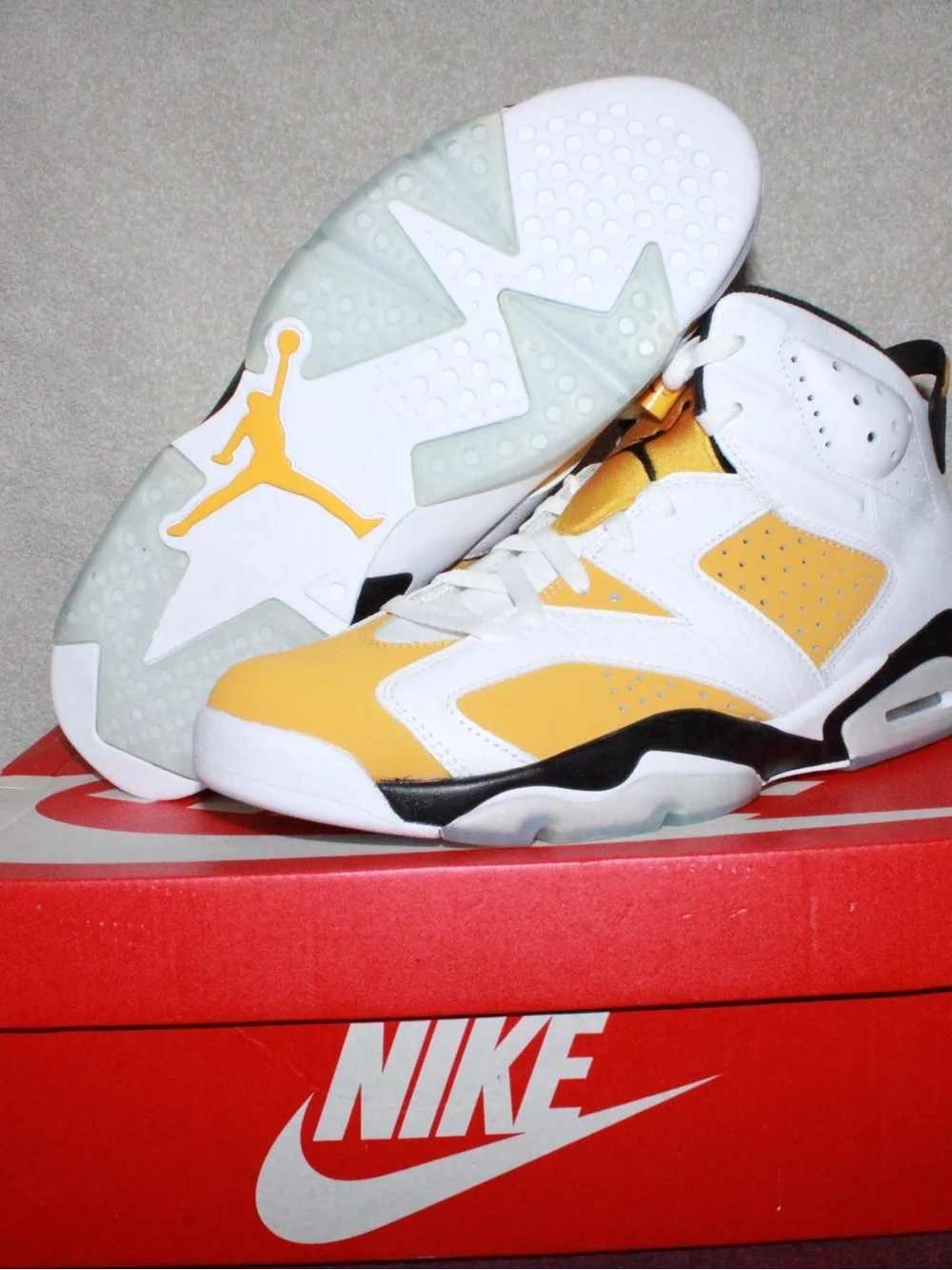 Nike Mens White and Yellow Ochre Jumpman Sneakers